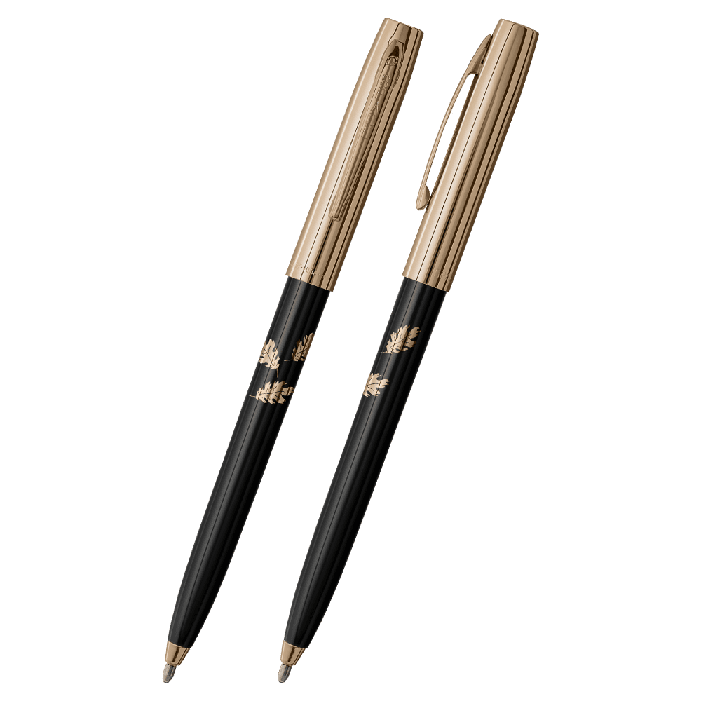 Front and side views of cap-o-matic space pen with black plastic barrel, gold colored cap with clip, gold colored tip, and imprinted gold leaves.