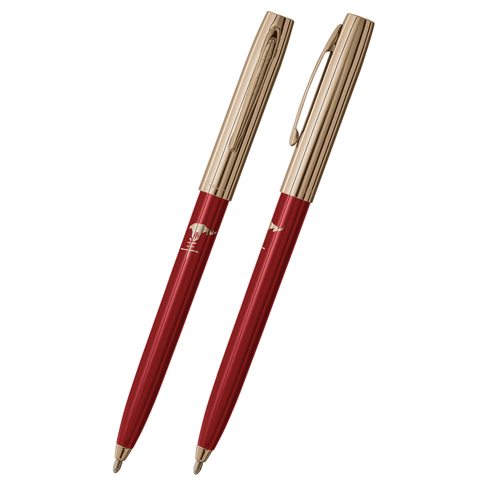 Front and side views of cap-o-matic space pen with red plastic barrel, gold colored cap with clip, gold colored tip, and imprinted gold Chinese character and goat.