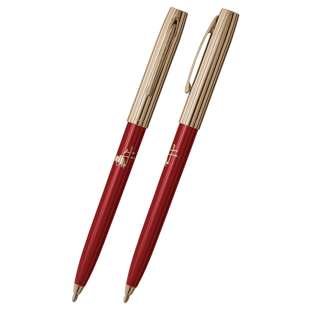 Front and side views of cap-o-matic space pen with red plastic barrel, gold colored cap with clip, gold colored tip, and imprinted gold Chinese character and ox.