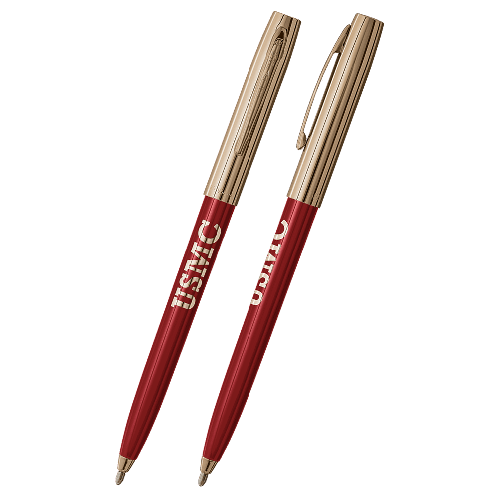 Front and side views of cap-o-matic space pen with red plastic barrel, gold colored cap with clip, gold colored tip, and imprinted gold US Marine Corps USMC.