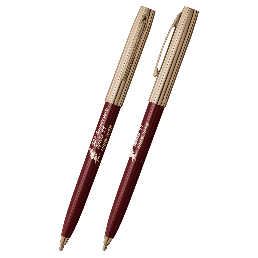 Front and side views of cap-o-matic space pen with burgundy plastic barrel, gold colored cap with clip, gold colored tip, and imprinted gold Apollo 11 50th Anniversary.